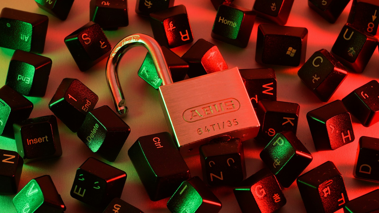 Physical security lock on keyboard keys with red and green cybersecurity illumination representing bare-metal network firewall architecture