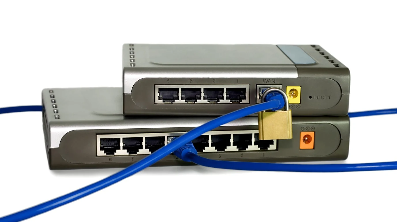 Enterprise network rack with glowing Ethernet patch cables and high speed firewall switch